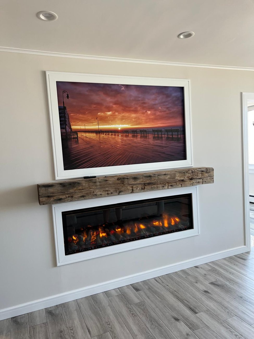 Fireplace feature wall with beam mantel