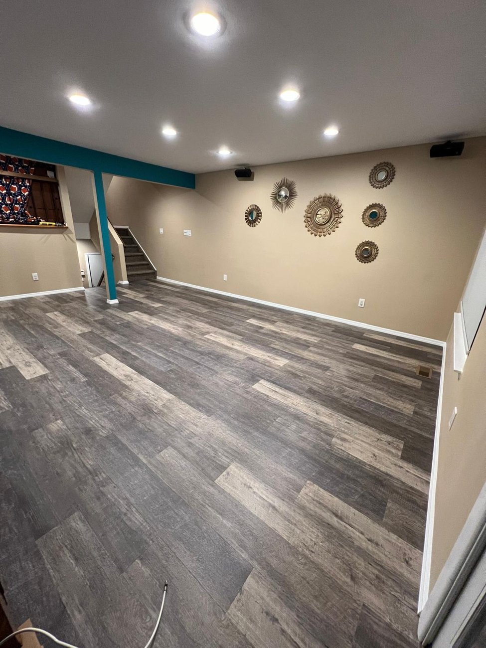 Finished family room with new vinyl plank flooring