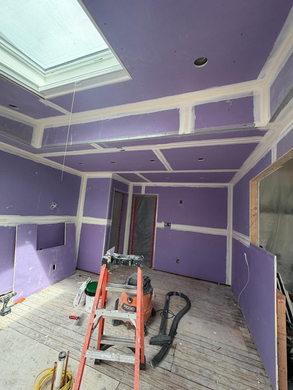 Taped seams and clean corners around the skylight, ready for finishing